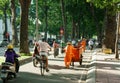 Asia city scene,sanitation worker, vehicle traffic