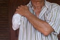 Asia elderly man with one arm and arm prosthetic