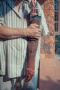 Asia elderly man with one arm and arm prosthetic