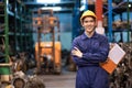 Asia engineer man worker wears a safety helmet and holding tablets. Crossed arm and standing in the automotive spare parts Royalty Free Stock Photo