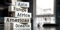 Asia, Europe, Africa, Americas, Oceania - words on wooden blocks