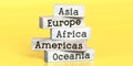 Asia, Europe, Africa, Americas, Oceania - words on wooden blocks