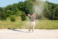 Asia Golfer man hitting out of a sand trap. The golf course is on the sand.  Hobby in holiday and vacations Royalty Free Stock Photo