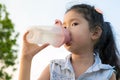 Asia little girl drinkink water