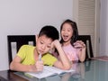 Asia little sister ridicule her brother studying and doing his h