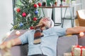 Asia man hangover and passed out sleep on sofa after heavy Chris Royalty Free Stock Photo