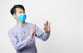 Asia man panic disorder wearing surgical mask covering mouth and nose. epidemic corona virus protection