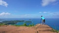 Asia man professional photography on the high mountain at Phahindum view point popular landmark in Phuket Thailand and shoots vide