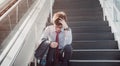 Asia man stressed from work sitting on steps outside