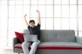 Asia man stretch oneself lazily while working with laptop Royalty Free Stock Photo