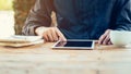 Asia man using tablet on table in coffee shop with vintage toned Royalty Free Stock Photo