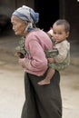 Asia, old woman with chicken and grandson Royalty Free Stock Photo