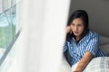 Asia people mournfully looks out her window Royalty Free Stock Photo