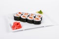 Asia. Rolls with salmon red fish on a white plate on a white b