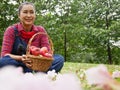 Asia senior woman smile portrait and holding red apple in garden park. Royalty Free Stock Photo