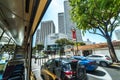 Singapore street scene seen from a moving public bus. Offices, skyscraper, shopping