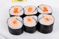 Asia. Spicy rolls with salmon red fish on a white plate on a w