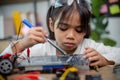Asia students learn at home in coding robot cars and electronic board cables in STEM, STEAM