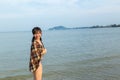 Teenage wearing bikini at the beach.