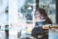 Asia teenage hipster in thinking alone at cafe.