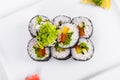 Asia. Vegetarian vegetable rolls on a white plate on a white background