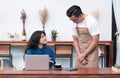 Asia woman customer complaining to waiter about food in cafe res Royalty Free Stock Photo