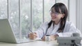 Asia woman doctor consulting patient with sickness symptoms online via video call on laptop , Remote Medical Consultancy concept