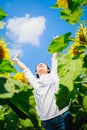 An Asia woman,girl happy in sunflower field in the morning. Royalty Free Stock Photo