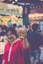 Asia woman holding a beer Royalty Free Stock Photo