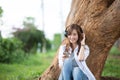 Asia woman listening music headphones outdoor Royalty Free Stock Photo