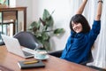 Asia woman relax after working,female raise arm up stretching in Royalty Free Stock Photo