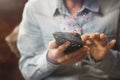 Asia woman `s hands using smartphone,mobile phone with happy. Royalty Free Stock Photo