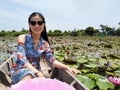 Lady on boat, red lotus floating market Royalty Free Stock Photo