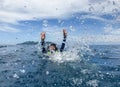 Asia woman swimming in sea and splash water to camera.Summer fun Royalty Free Stock Photo