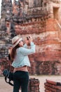 Asia woman take image ancient temple by smarth phone