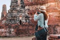 Asia woman take image ancient temple by smarth phone