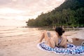 Woman is using tablet on the beach Royalty Free Stock Photo