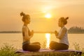 Asia woman yoga on sunset