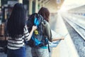 Asia women with bag backpack and map, preparing for traveler trip at train station. Royalty Free Stock Photo