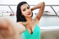 Asia young woman smile portrait selfie photo traveling on speed boat in summer for relaxation at Thailand. Royalty Free Stock Photo