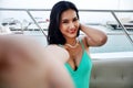 Asia young woman smile portrait selfie photo traveling on speed boat in summer for relaxation at Thailand. Royalty Free Stock Photo