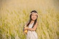 Asiagirl playing guitar to meadow outdoor in nature Royalty Free Stock Photo