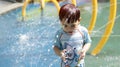 Asian adorable boy having fun with pool fountain shot during summer time Royalty Free Stock Photo