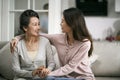 Asian adult daughter and senior mother chatting at home Royalty Free Stock Photo