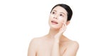 Asian adult girl applying cream on her skin Royalty Free Stock Photo