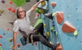 Asian adult healthy senior strong man climbing rock mountain as hobby with happiness and amusement for adventure and sport. Royalty Free Stock Photo