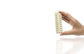 Asian adult woman hand holding pack of contraceptive pills Royalty Free Stock Photo