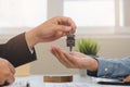 Asian agent giving a key to new owner or tenant, client after signed signature contract rental purchase, buyer apartment, home Royalty Free Stock Photo