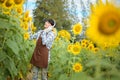 Asian agriculture is resting in the sunflower field. Happy after work Royalty Free Stock Photo