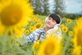 Asian agriculture is resting in the sunflower field. Happy after work Royalty Free Stock Photo